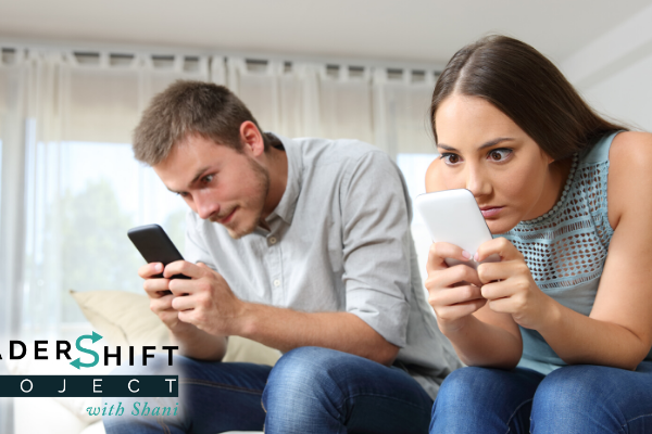 Obsessed couple with their smart phones ignoring each other