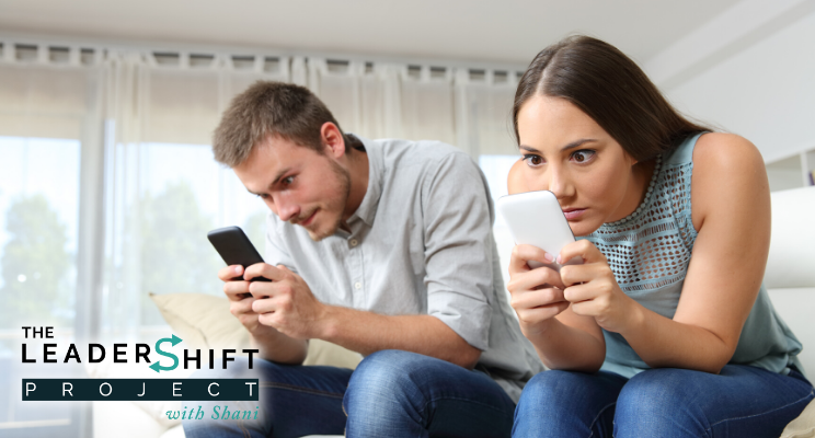 Obsessed couple with their smart phones ignoring each other