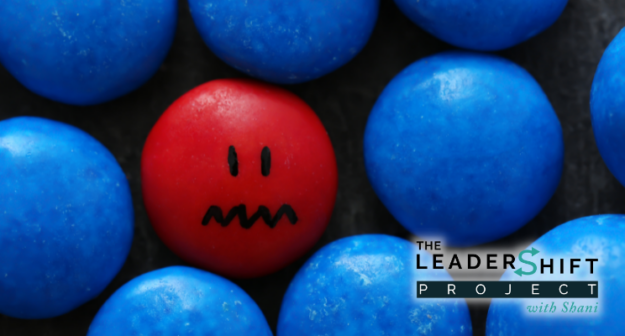 A red bead feels insecure and unsafe in a pool of blue beads.