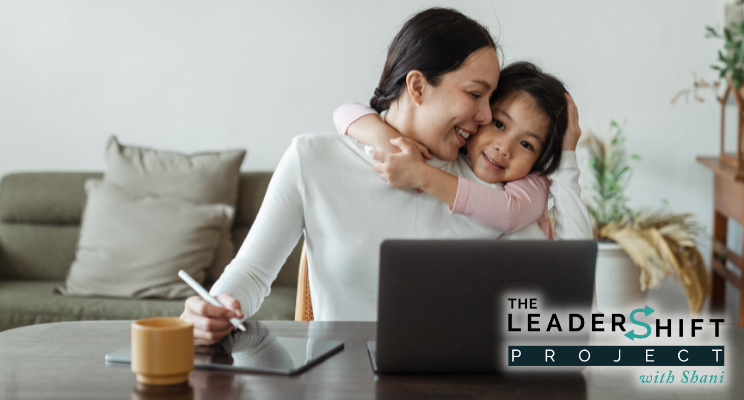 Returnship Article header Mother hugs daughter while working