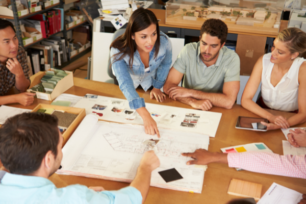 Leading a team of building contractors under the direction of a female leader
