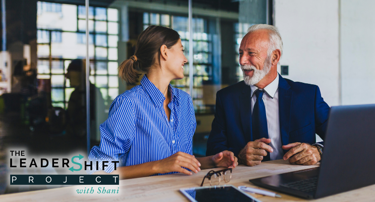 A manager and direct report have a one-on-one conversation in the workplace.